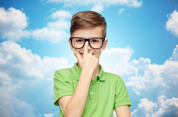 Canvas Print - happy boy in green polo t-shirt and eyeglasses