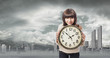 © asierromero - portrait of a pretty young woman holding a big clock