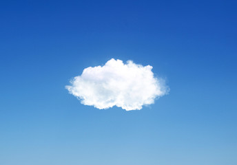 single cloud flying in the deep blue sky
