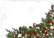 Christmas border of holly, mistletoe, cones over white backgroun