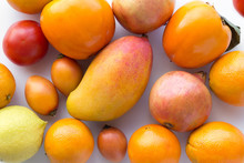 Many Fresh Orange Fruits On White Background -