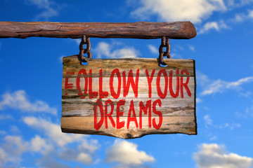 Follow your dreams motivational phrase sign