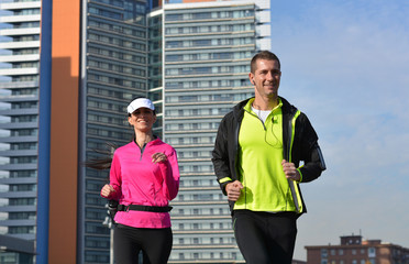 Wall Mural - couple practicing running in the city