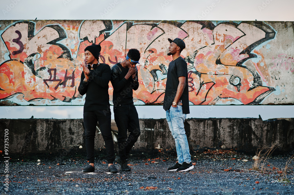 Three rap singers band on the roof background graffiti wall - obrazy, fototapety, plakaty 