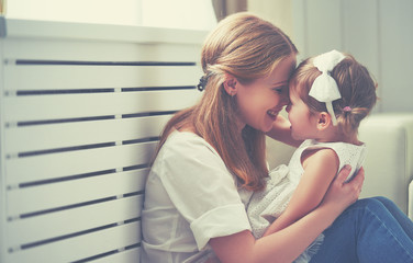 Poster - Happy loving family. mother and child playing,  kissing and hugg