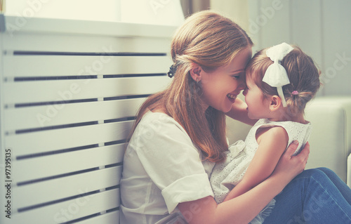 Fotografie, Obraz Happy loving family. mother and child playing, kissing and hugg
