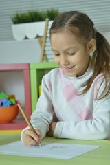 Wall Mural - little girl drawing at home