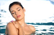 © Africa Studio - Beautiful young woman at swimming pool