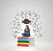 © ImageFlow - woman on pile of books a book on her knees thinking about educat