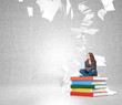 © ImageFlow - young woman on  pile of books with paper flying around