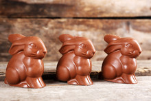 Chocolate Easter Bunnies On Wooden Background