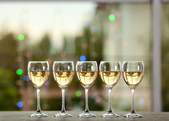 Poster - Wine glasses with wine on a table outside