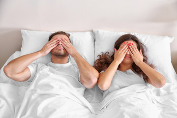 Wall Mural - Happy couple snoozing on bed