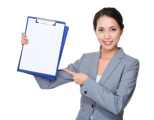 Wall Mural - Young Businesswoman showing with blank page of clipboard