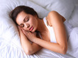 © shefkate - Beautiful young woman lying on bed