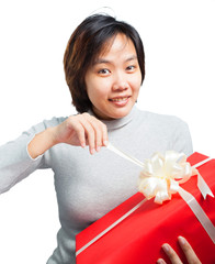 Christmas, x-mas, birthday, winter and people concept - woman opening gift box with smile face