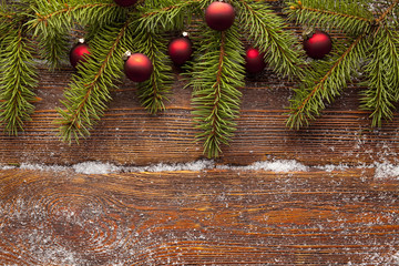 Sticker - Branch of Christmas tree and baubles on wooden background