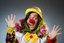 Clown With Tulip Flowers In Funny Concept