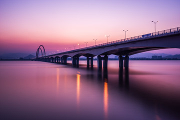 sunrise,sunset skyline and bridge over river