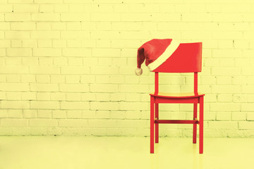 Wall Mural - Santa hat on a chair.