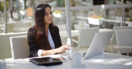 Poster - Businesswoman working at an open-air table