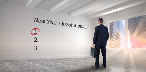 Canvas Print - Businessman looking at new year's resolution list