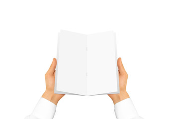 Fototapete - Hand in white shirt sleeve holding blank brochure booklet in the hands