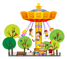 Wall Mural - Children riding on giant swing at the park