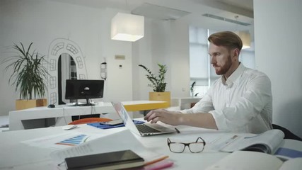 Aufkleber - Attractive business man working at the office and looking at photo frame