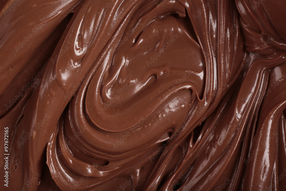 Background of thick melted milk chocolate, close-up