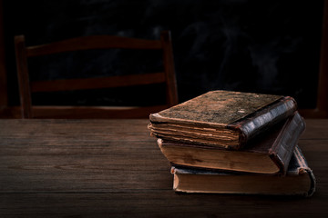 Canvas Print - Few books on wooden table