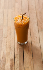 Wall Mural - Ice tea with glass on blurred wooden background