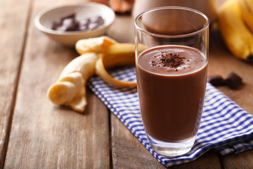 Wall Mural - Glass of chocolate milk on table close-up