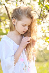 Wall Mural - portrait of little girl outdoors in summer