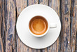 © joesayhello - top view a cup of espresso coffee on wooden table