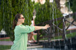 © Himchenko - beautiful woman near the city fountain