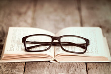 Reading Glasses On The Old Book