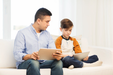 Poster - father and son with tablet pc at home