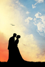 Bride And Groom Silhouette At Sunset