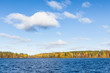 Lake landscape autumn colors forest and blue sky
