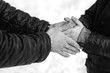 © familylifestyle - The hands of father and son in black and white