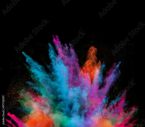 Launched colorful powder on black background