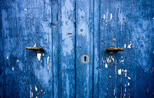 Old Blue Wood Door With Two Door Knobs