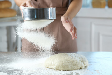 Poster - Making dough by female hands at bakery