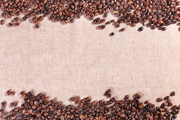  Frame of roasted coffee beans on the linen fabric