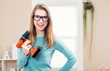 Young Woman With Cordless Drill