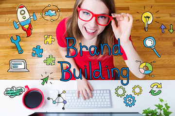 Wall Mural - Brand Building concept with young woman