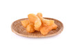 deep fried dough stick on wicker basket with white background