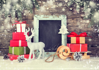 Christmas background with gift boxes and festive decoration.