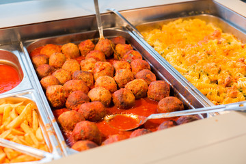 close up of meatballs and other dishes on tray